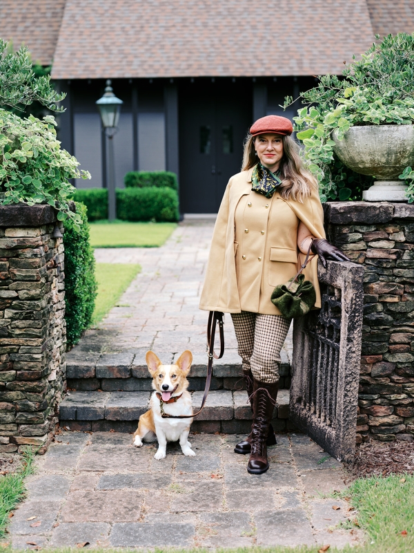 Wool artisan in Charleston, South Carolina with corgi dog and holding a green cinch sack purse