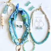 A flat lay of an assortment of turquoise jewelry 