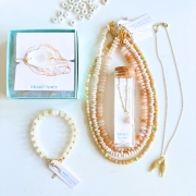 An assortment of neutral jewelry 