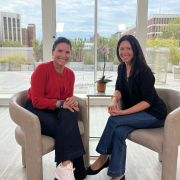 Julie Kaminski and Jennie Brooks seated together at Longevity Club, smiling during an interview about health coaching
