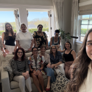 Julie Kaminski leading a SAVOR Society gathering, with women seated together in conversation about thriving mind and body.