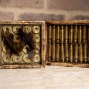 Resin coasters made with duck feathers and bullet casings