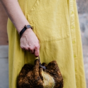 Brown with yellow stripe handmade wool bag cinch sack in circle shape with leather handle