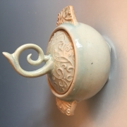 Spiral jar thrown with textured slab lid and handles 