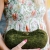 Green handmade wool clutch with bronze clasp
