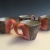 Cup set, soda fired, carved and underglazed