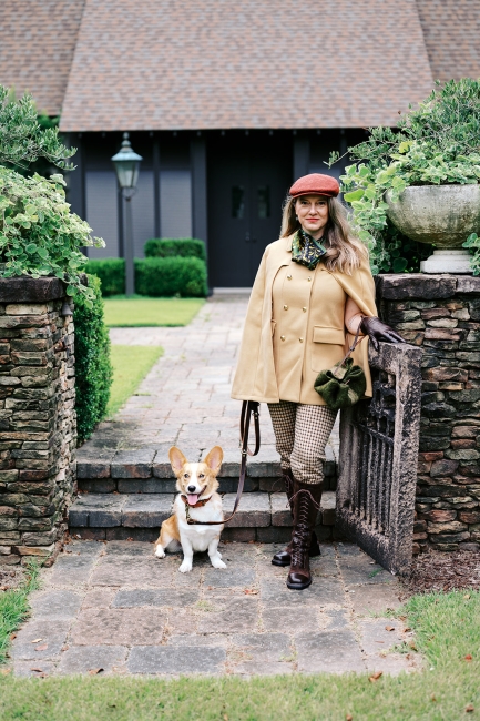 Wool artisan in Charleston, South Carolina with corgi dog and holding a green cinch sack purse